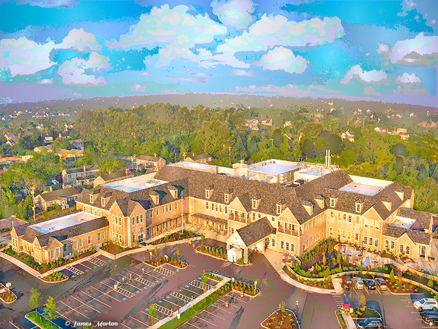 Aerial fine art print of Nantucket Cottage Hospital surrounded by trees and sky, with gabled roofs and coastal landscape. Fine Art Print available on canvas or watercolor paper.