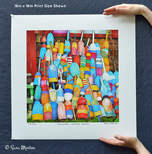 Hand-held scale view of colorful "Rockport Lobster Buoys" fine art watercolor print by Sara Morton, 16x16in limited edition