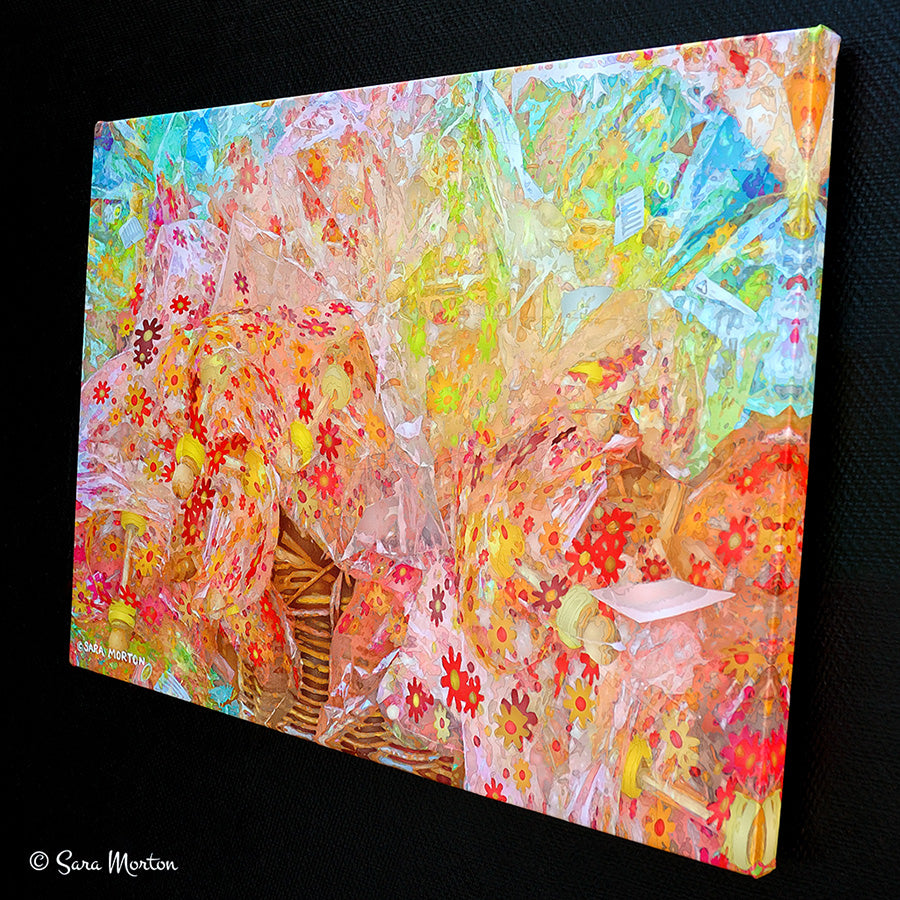 Colorful abstract floral canvas print with swirling patterns. Right side view highlights image wrapped edges.