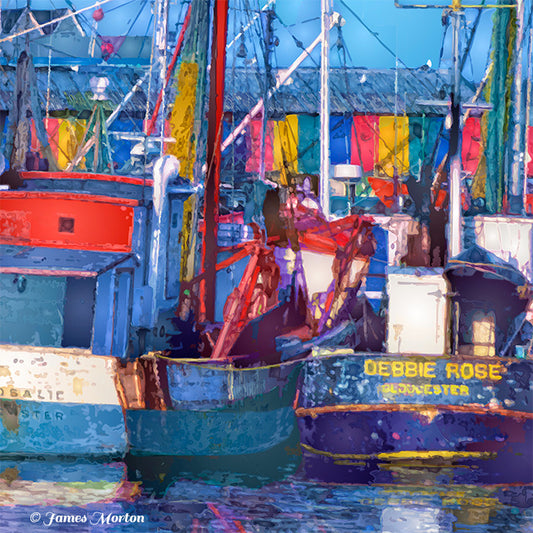 Gloucester fishing boats art print close-up showing hulls, lobster boats, rigging, and colorful marina building at Old Fisherman’s Wharf.