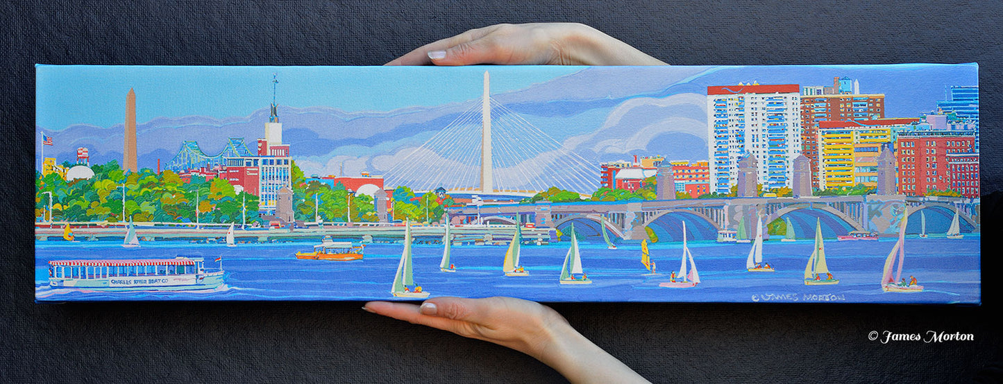 Boston skyline canvas print wall art being held to show size and quality, featuring bridges and Charles River scene