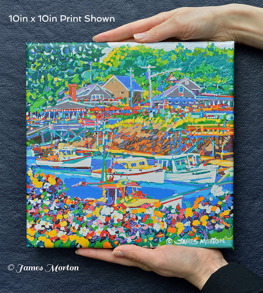 Front view of 10x10 inch stretched canvas print of colorful Perkins Cove painting by James Morton. Hand held for scale. 