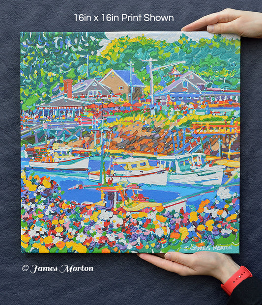 16x16 canvas print of Perkins Cove Maine held for size reference – features boats, flowers, Barnacle Billy’s.
