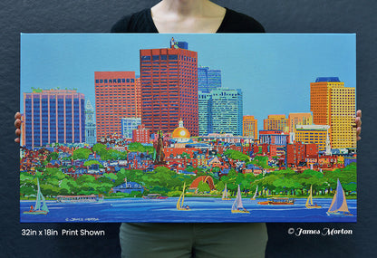 Person holding a 32 × 18 ready-to-ship Boston skyline canvas print featuring Beacon Hill, the Charles River, sailboats, the Hatch Shell, Union Boat Club Boathouse, and the Massachusetts State House for size reference.