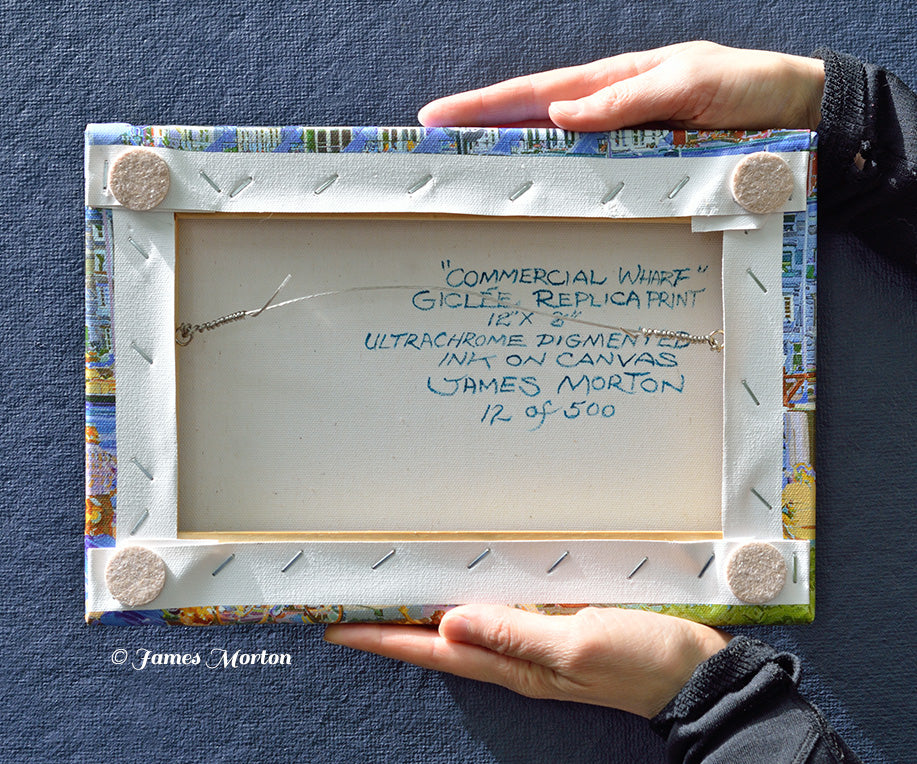 Back of 12x8 stretched canvas print hand signed, titled, and numbered by the artist, shown hand held for scale.