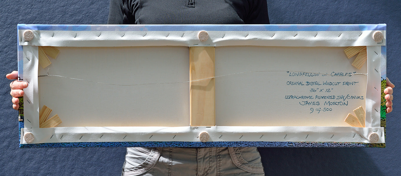 Back of 36 x 12 stretched canvas print hand signed, titled, and labeled by artist James Morton, shown held by hand for size reference.