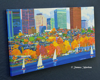 Left angled view of Boston panoramic canvas print featuring Beacon Hill, autumn trees, sailboats on the Charles River, Community Boating, mirrored wrapped edges, and the artist's signature in the lower right corner.