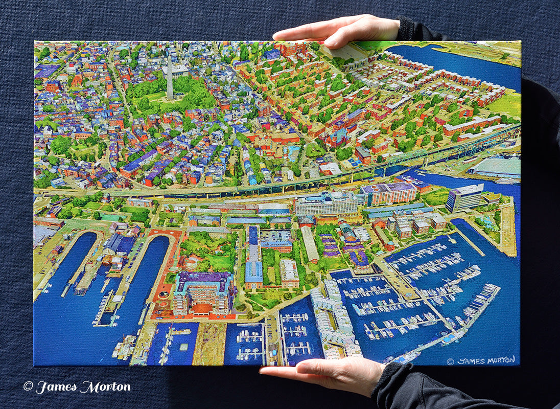 Hand-held 24 x 16 Charlestown Boston canvas print showing the artwork scale and aerial view of the historic waterfront neighborhood.