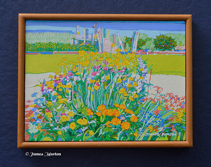 Framed original acrylic painting of a Wellfleet, Massachusetts coastal garden with colorful flowers, green grass, and a wooden dock leading to a tidal marsh with blue water. Artist James Morton's signature is visible in the bottom right corner.