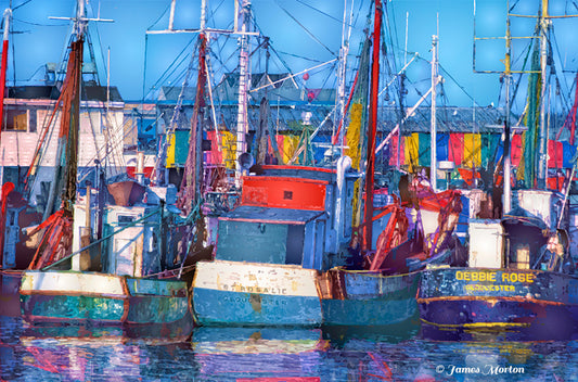 Gloucester harbor art print with fishing boats, rigging, and red-blue-green marina building at Old Fisherman’s Wharf.