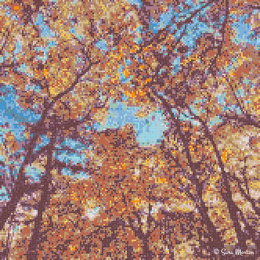 digital mosaic art print of autumn trees with orange and gold leaves looking upward against a blue sky.